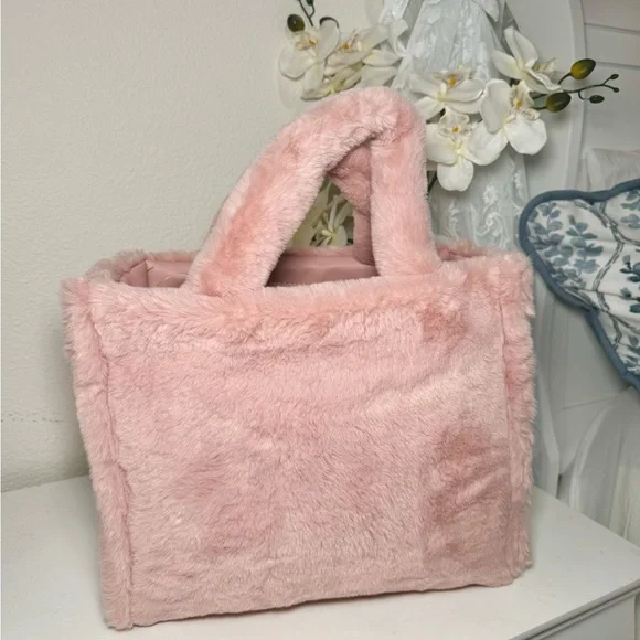 Juicy Couture Let’s Get Cozy Tote in Blush Pink.